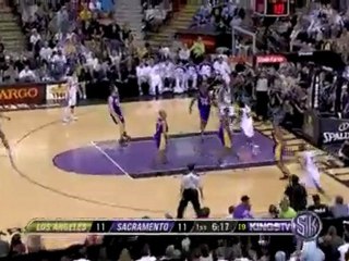 Tyreke Evans spins right past Ron Artest for two points.