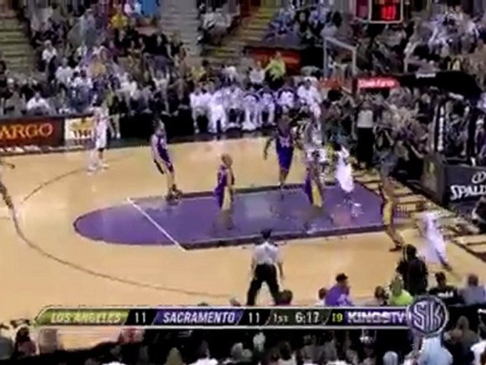 Tyreke Evans spins right past Ron Artest for two points.