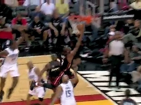 Dwyane Wade splits a double-team on his way to the bucket an
