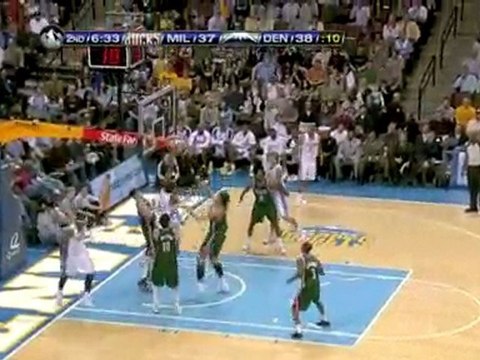 Carmelo Anthony hits Nene inside with a quick pass for the d