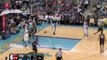 Marcus Camby throws down a two-handed jam off the feed from