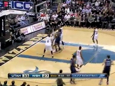 Mehmet Okur drives to the basket and drains the tough shot.