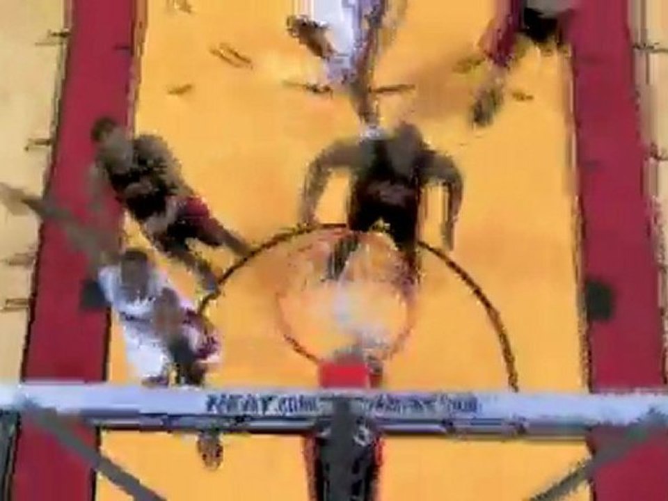Dwyane Wade takes the pass and finishes with a nice slam.