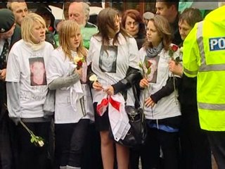 Crowds in silent tribute to fallen soldiers