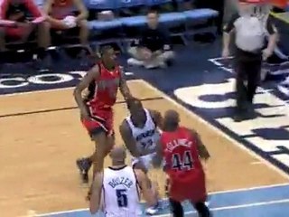Wesley Matthews goes around one defender and over another fo