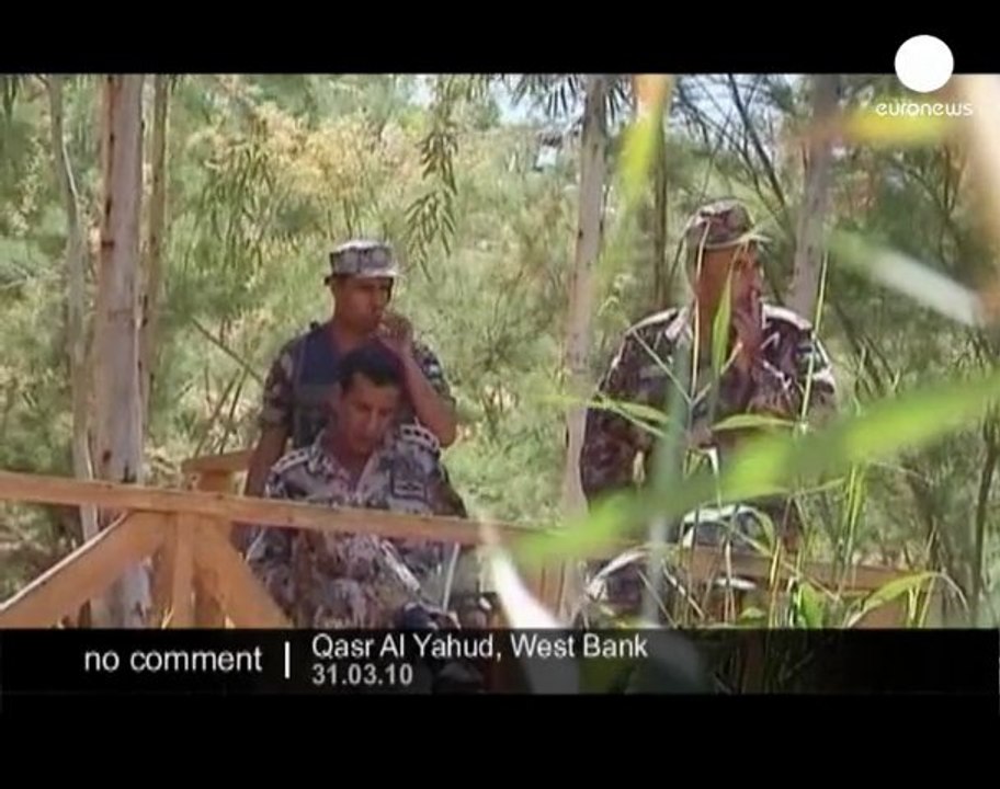 Christians re-enact the traditional baptism of Jesus in...