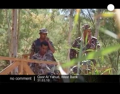 Christians re-enact the traditional baptism of Jesus in...