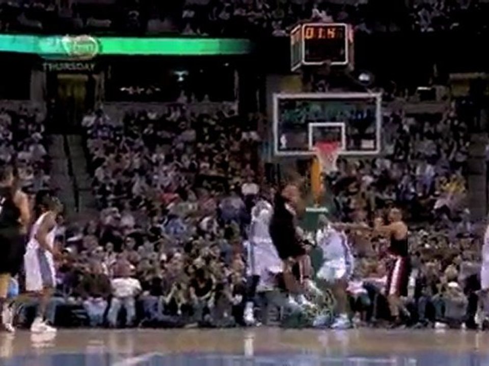 Marcus Camby grabs the rebound and hits the shot before the