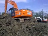 Doosan Dx 225 Excavator on a jobsite