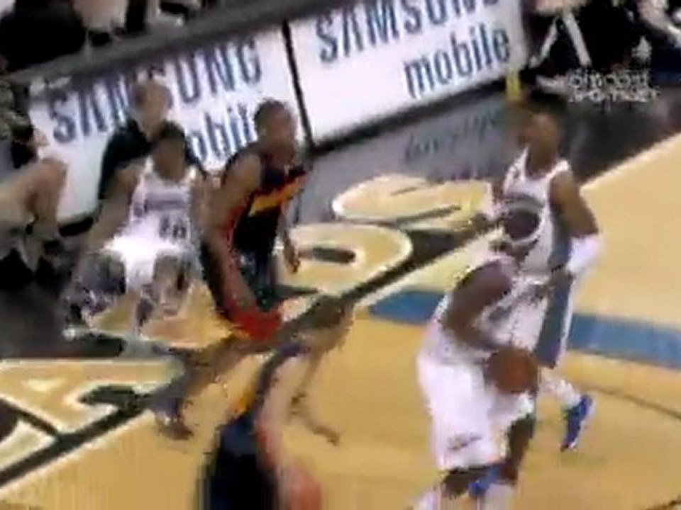 Reggie Williams blocks a shot into the stands during the fir