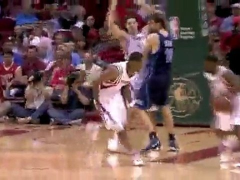 Aaron Brooks heads down the court off the Trevor Ariza still