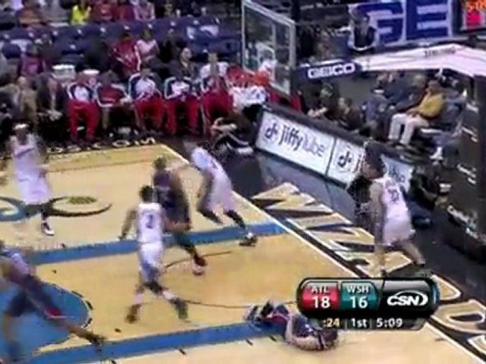 Mike Bibby somehow gets this circus shot to fall.