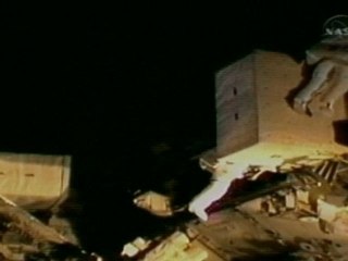 Astronauts use hammer and crowbar for repair job