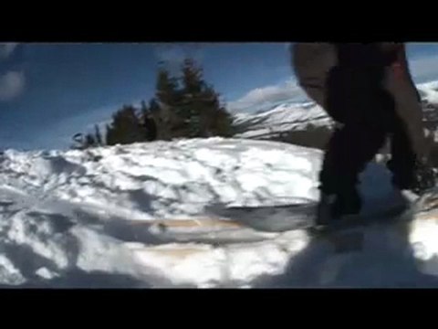 Snowboarding on a Sakteboard off cornice PinPin