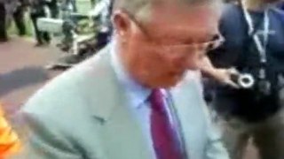 Sir Alex Ferguson signs green and gold scarf