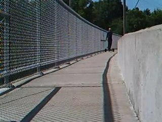 Dog pulling tricky man on trike.