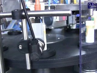 Semi-automatic tube filling and sealing machine