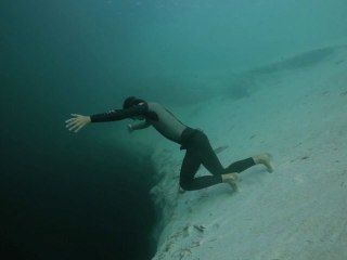 Guillaume Nery base jumping at Dean's Blue Hole