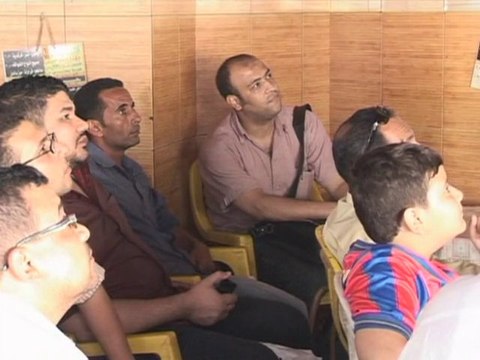Left out: Egyptians watch on as Algeria plays World Cup match