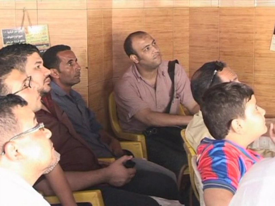 Left out: Egyptians watch on as Algeria plays World Cup match