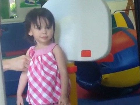 Angela Toddler Admires Her Reflection