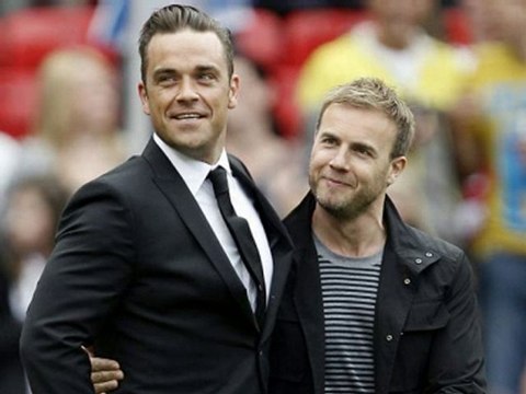 Robbie rejoins Take That