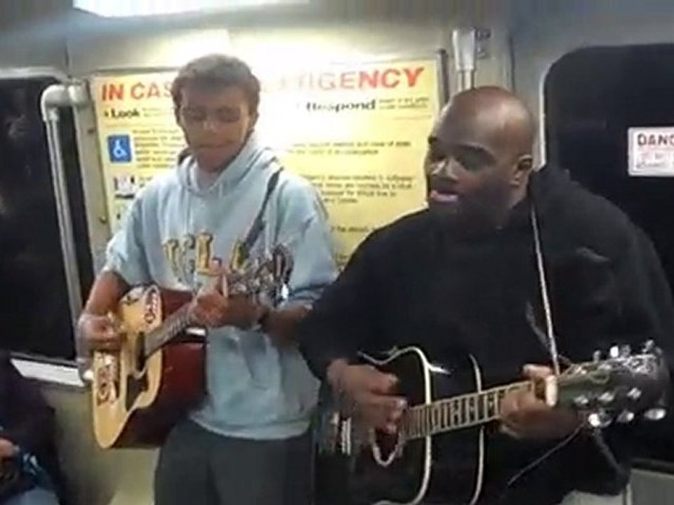 Musicians playing Beatles Norwegian Wood on BART train