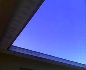 Helicopter circling area with a ball attached to bottom