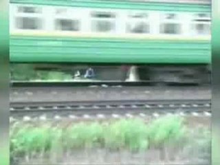 Russian Girl Lies Underneath Speeding Train