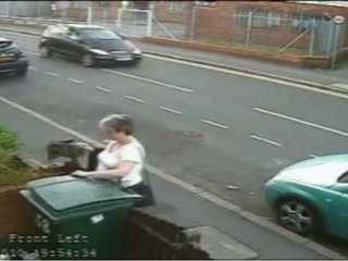Woman Caught Dumping Cat in Trash Bin on CCTV