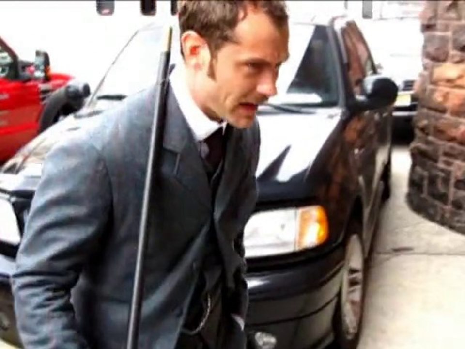 SNTV - Jude Law smiling despite drama