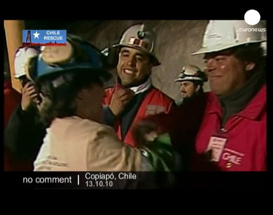 Chile miners: Osmán Araya reaches the surface - no comment