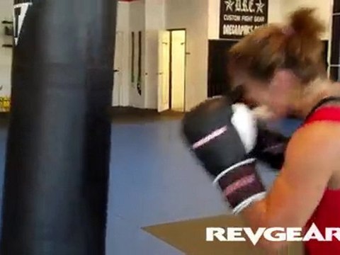 Cyborg Santos MMA Training with MMA Gloves on the Bag