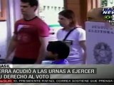 José Serra vota acompañado de sus nietos