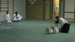 Martial arts class-Aikido grappling with the Jo Staff