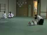 Martial arts class-Aikido grappling with the Jo Staff