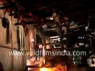 Apatani women cooking pig