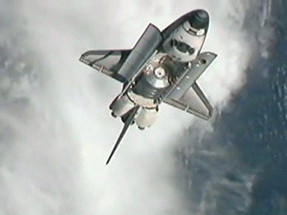 Shuttle docks with space station for last time