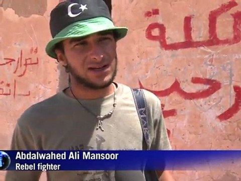 Libyan rebels battle to keep grip on mountain hamlet