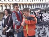 Italy travel: Venice's St. Mark's Square feeding pigeons, pa