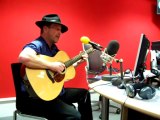Darragh MacAnthony lies down to listen to BBC radio Cambridg
