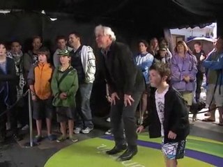 Grandpa and grandson playing Kinect Adventures on Xbox 360