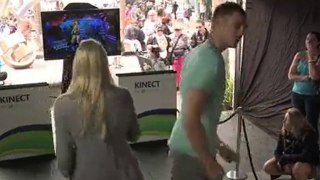 A guy and a girl playing Dance Central on Xbox Kinect