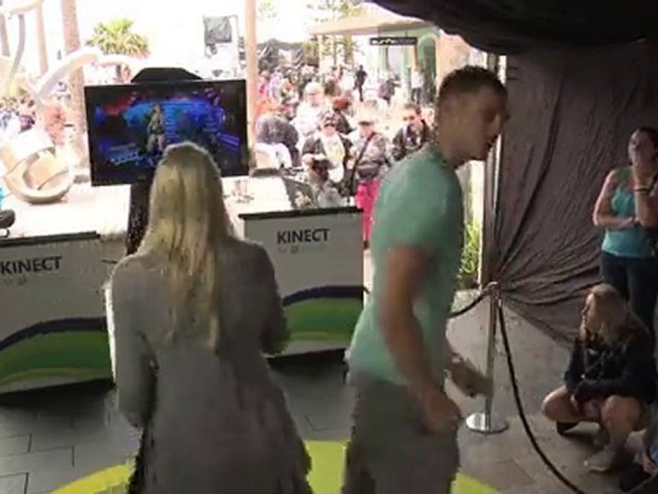 A guy and a girl playing Dance Central on Xbox Kinect