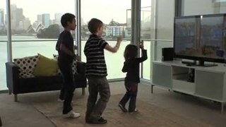 Three kids playing Dance Central for Xbox Kinect