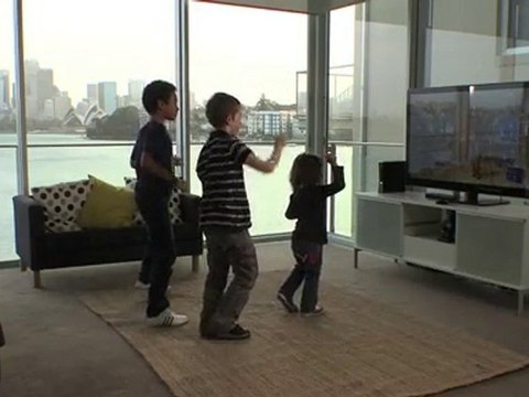 Three kids playing Dance Central for Xbox Kinect