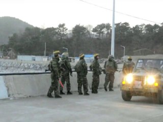 South Korean marines patrol bombed island