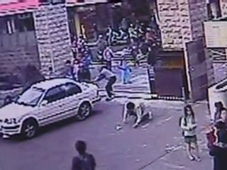 Car crashes through school gates and into children