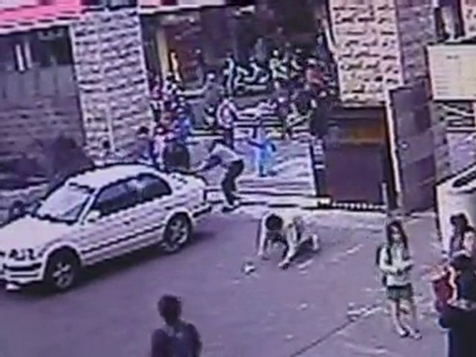 Car crashes through school gates and into children