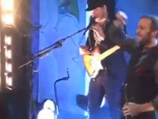 Chris Martin performs with the homeless